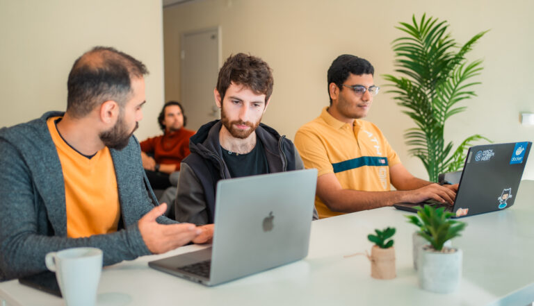 Students studying together in a shared living room, highlighting collaborative study spaces designed for international students in student accommodation