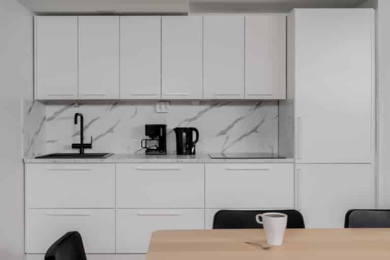 Clean, light-toned kitchen area with coffee and kettle, part of modern student accommodation for both local and international students